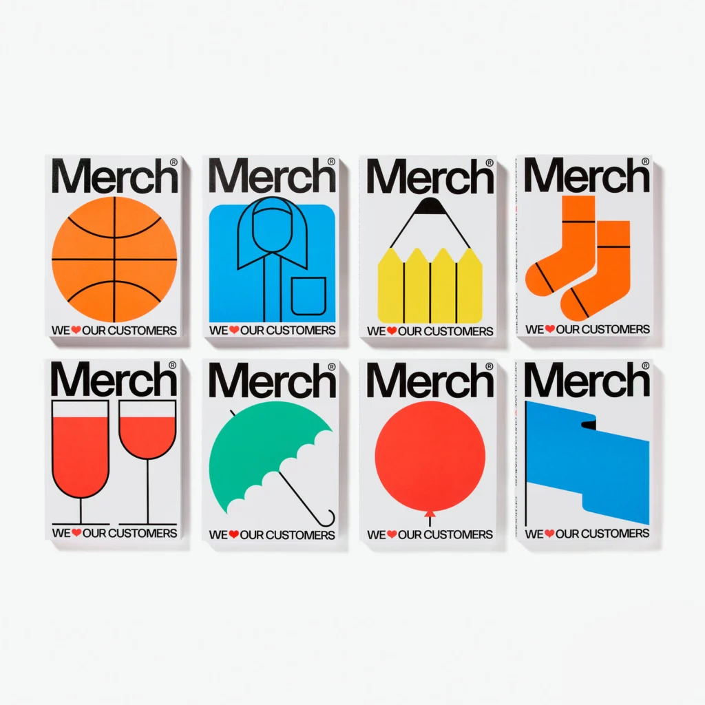 As oito capas de Merch lado a lado sobre fundo branco, cada uma com um objeto ilustrado em cor chapada: bola de basquete, camisa, lápis, meias, taças, guarda-chuva, balão e bandeira, e a frase We love our customers com um coração vermelho