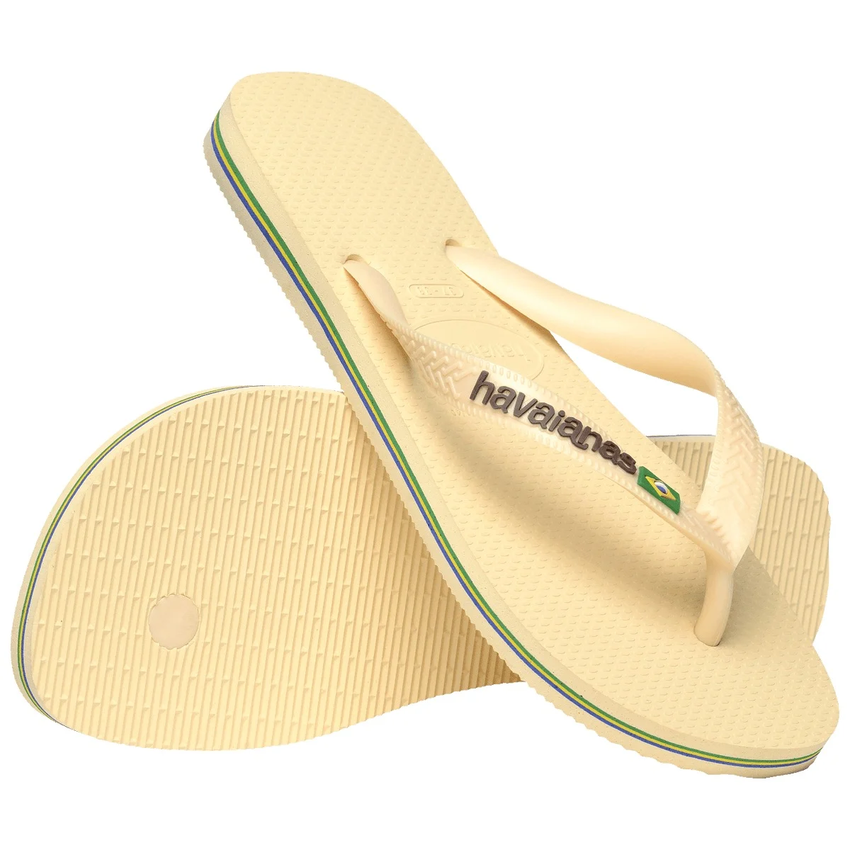 Par de chinelos Havaianas Brasil Logo Encardida, um apoiado sobre o outro, mostrando a sola
